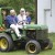 Bride and groom leaving on a tractor