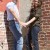 Engaged couple at the corner of brick walls