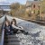 Brother and sister sitting on the railroad tracks