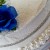 Wedding cake with bling and blue flowers