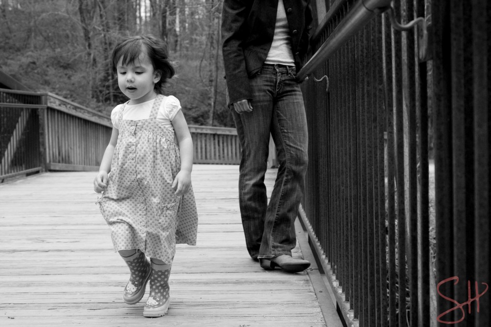 Little girl walking with her mom