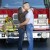 Engaged couple kissing in front of a firetruck