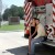 Engaged couple sitting on a firetruck