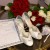 Marriage certificate with shoes, garter, and flowers